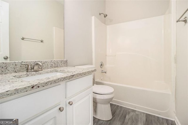 full bathroom featuring vanity, shower / bath combination, wood finished floors, and toilet