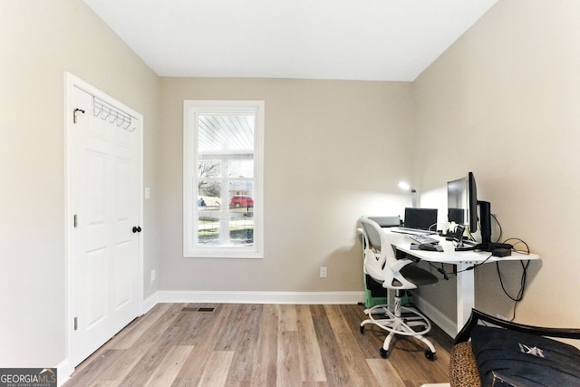 office space featuring wood finished floors and baseboards