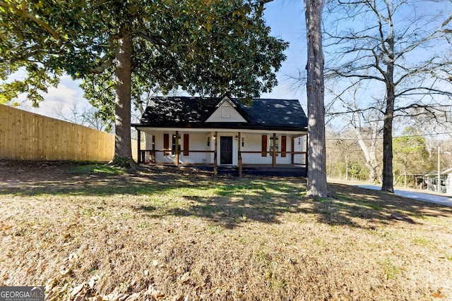 view of front of home featuring a porch and a front yard