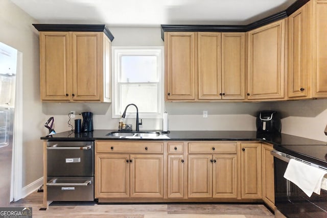 kitchen featuring baseboards, dark countertops, stainless steel range with electric cooktop, light wood-type flooring, and a sink