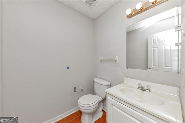 bathroom with visible vents, toilet, tile patterned flooring, a textured ceiling, and vanity