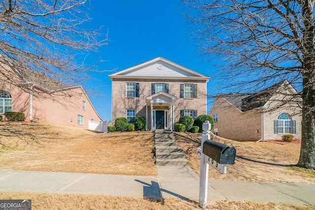 view of front facade featuring brick siding