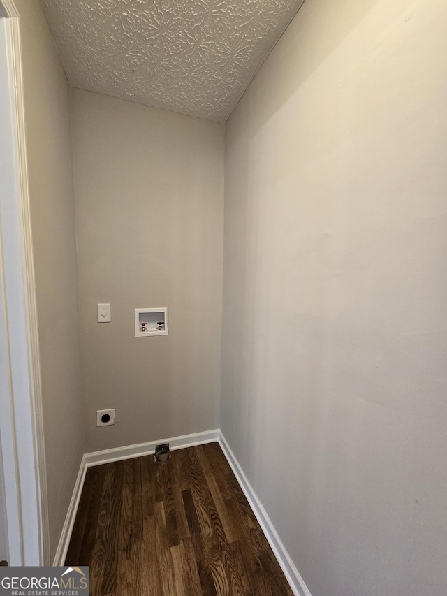 clothes washing area featuring laundry area, baseboards, dark wood-style floors, washer hookup, and electric dryer hookup