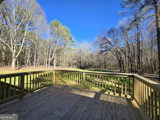 deck featuring a forest view