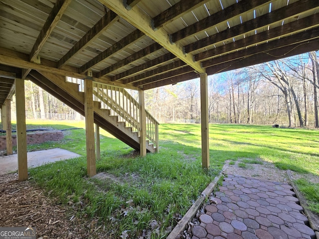 view of yard with a patio and stairway