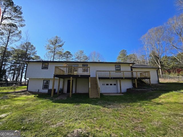 rear view of property featuring a lawn, fence, a deck, a garage, and stairs