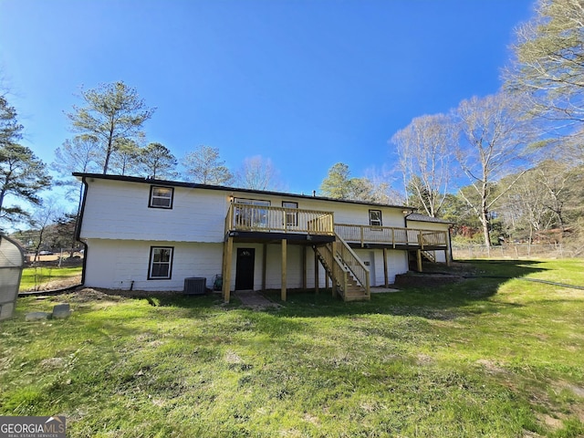 rear view of house featuring central AC, a yard, a deck, and stairs