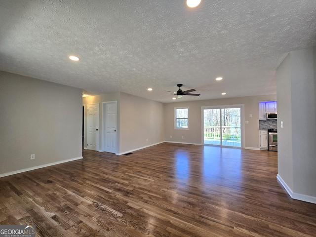 unfurnished living room featuring recessed lighting, dark wood-style flooring, ceiling fan, and baseboards