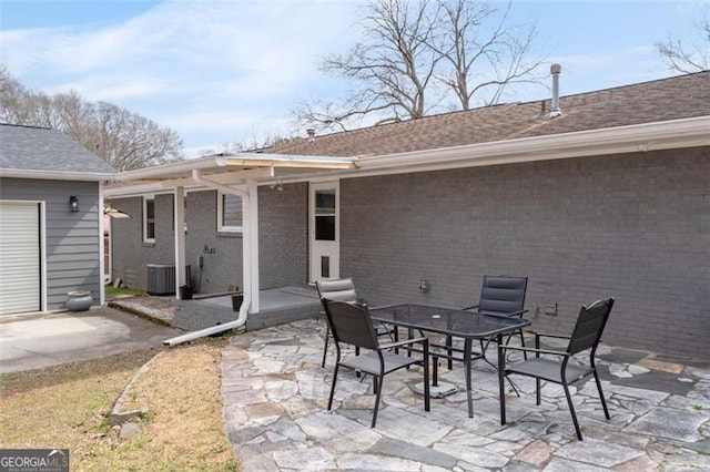 view of patio / terrace with outdoor dining space and central AC unit