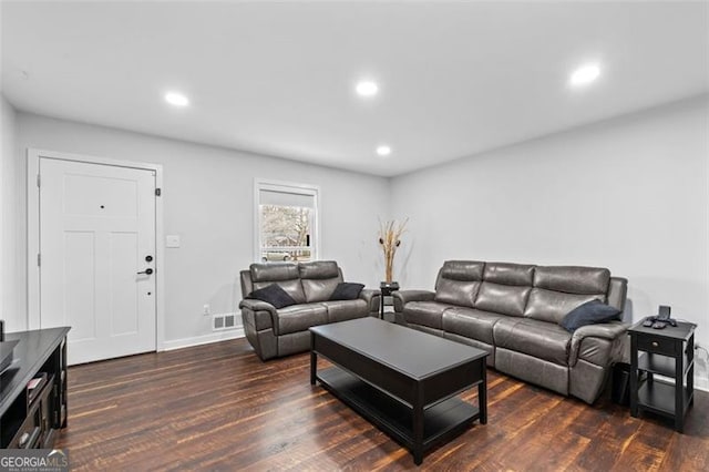 living area with visible vents, wood finished floors, and recessed lighting