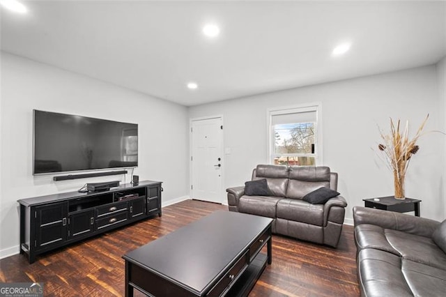 living room featuring recessed lighting, dark wood-style flooring, and baseboards