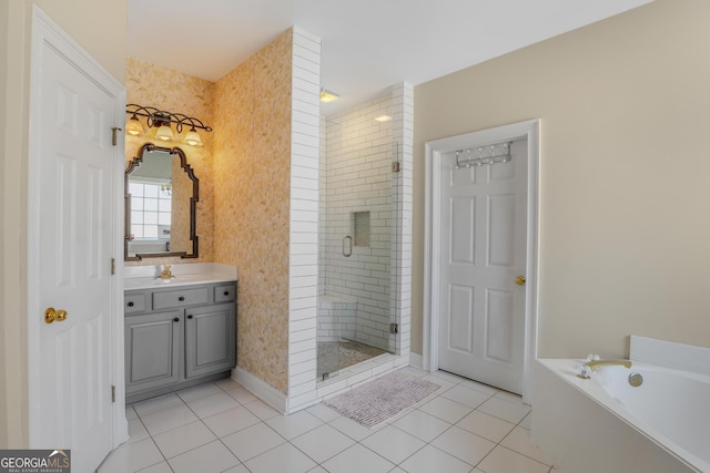 bathroom with a bath, a stall shower, vanity, and tile patterned floors