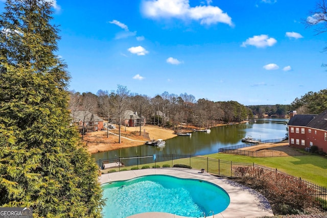 view of pool with a water view, a fenced in pool, fence, and a lawn