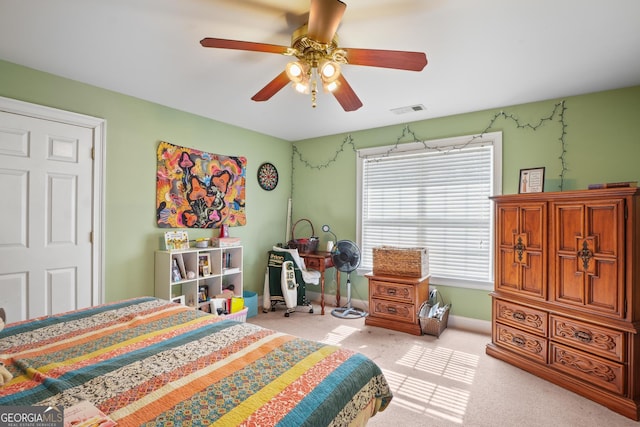 bedroom with carpet, visible vents, ceiling fan, and baseboards