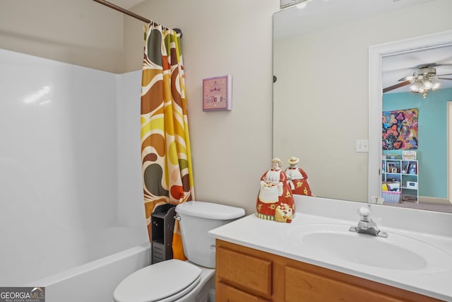 bathroom with toilet, ceiling fan, shower / bath combo with shower curtain, and vanity