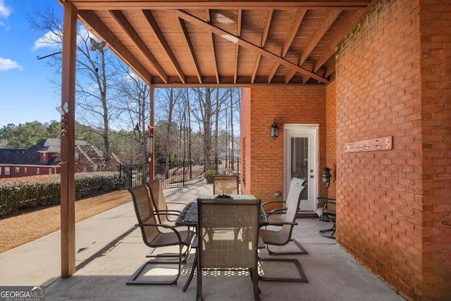 view of patio / terrace featuring fence and outdoor dining space