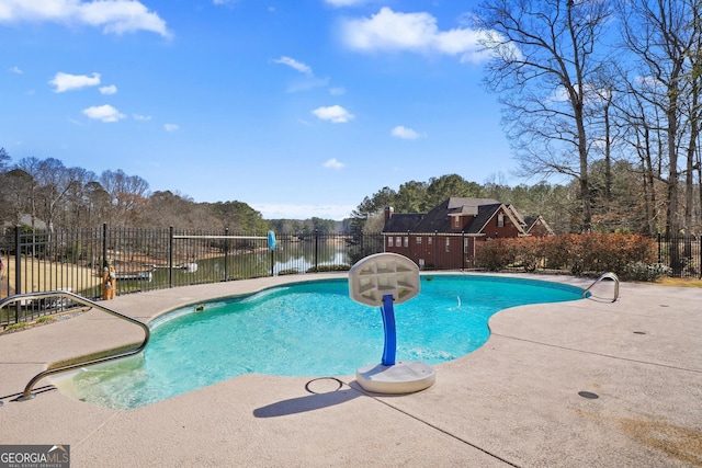 view of swimming pool featuring a patio area, fence, and a fenced in pool