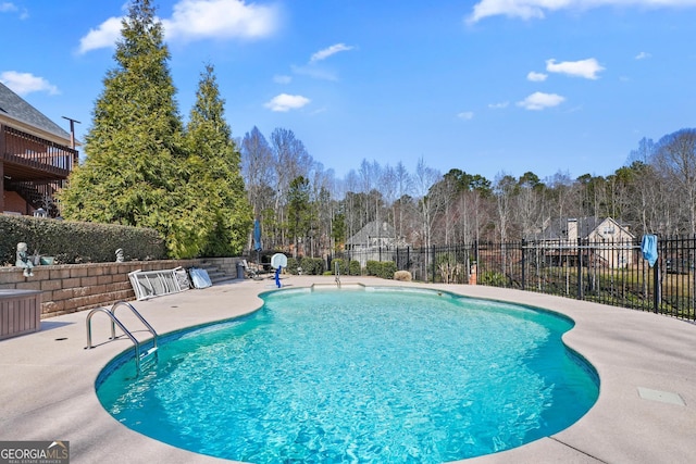 view of pool with a patio area, fence, and a fenced in pool