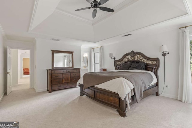 bedroom featuring light colored carpet, visible vents, baseboards, ornamental molding, and a raised ceiling