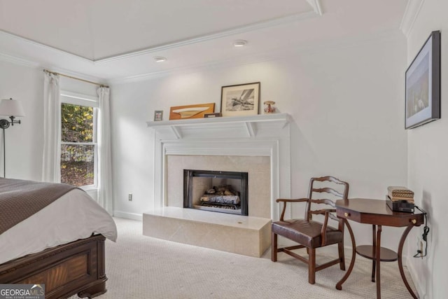 bedroom with ornamental molding, a fireplace, carpet flooring, and baseboards