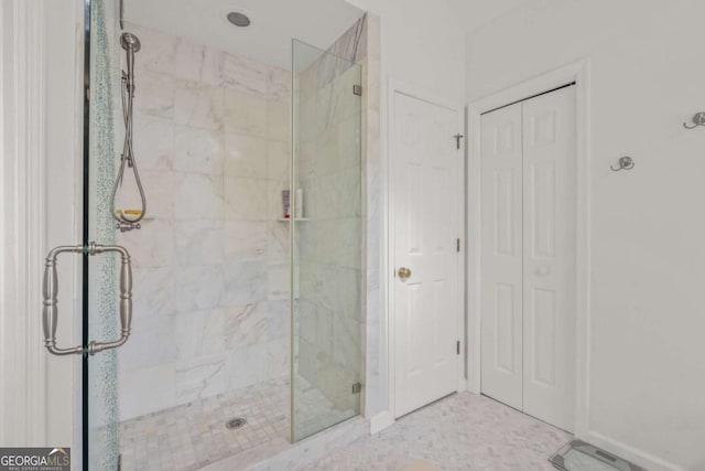 full bath featuring a closet and a shower stall