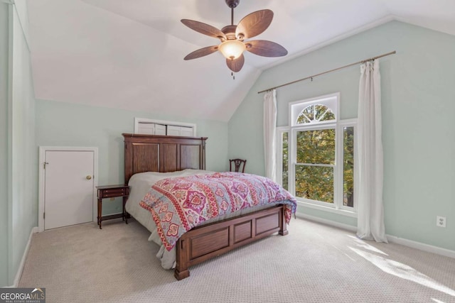 bedroom featuring vaulted ceiling, carpet flooring, a ceiling fan, and baseboards