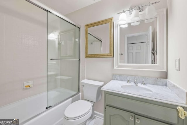 full bath with combined bath / shower with glass door, vanity, and toilet