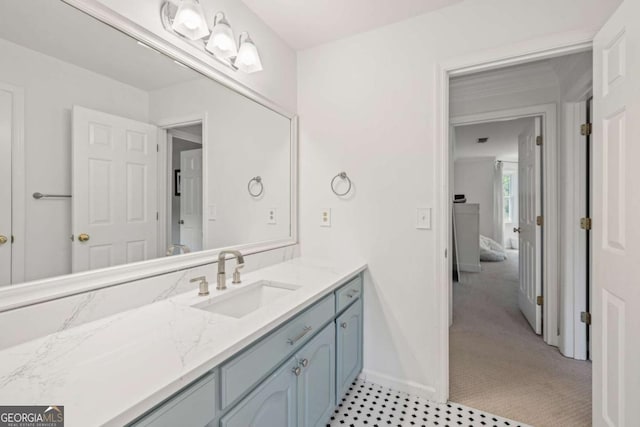 bathroom featuring vanity and baseboards