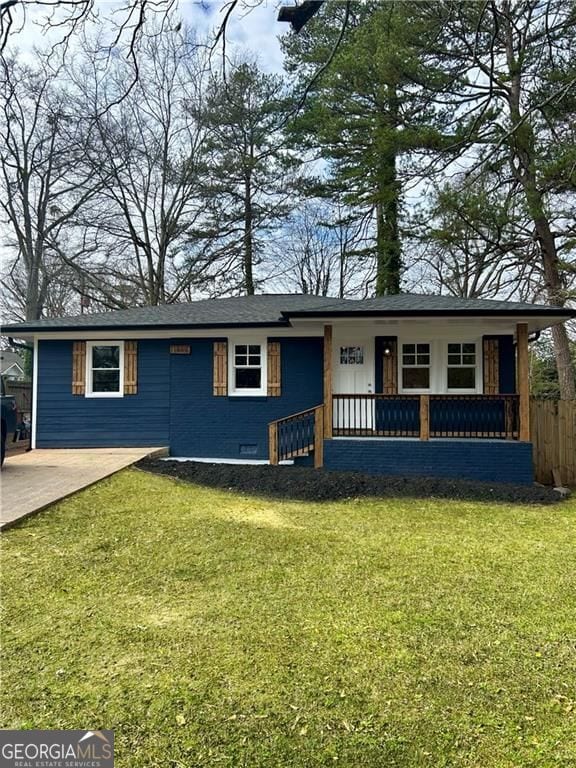 single story home featuring covered porch, fence, a front lawn, and concrete driveway