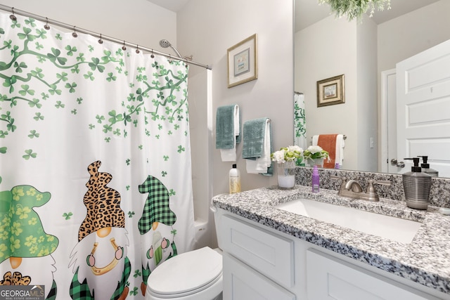 bathroom with vanity, toilet, and a shower with curtain