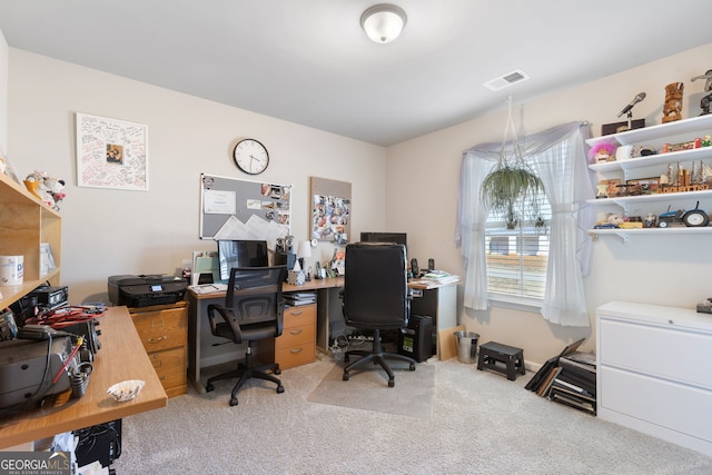 office area with light colored carpet and visible vents