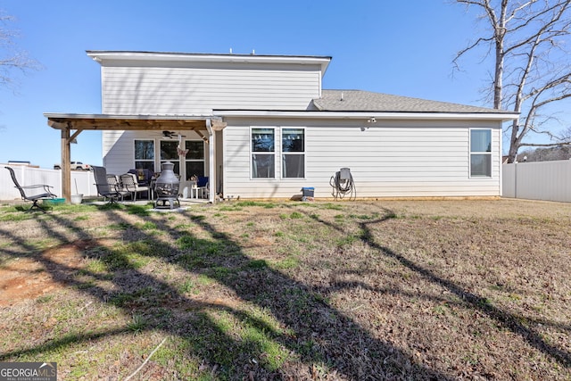 back of house with a patio area, a lawn, ceiling fan, and fence