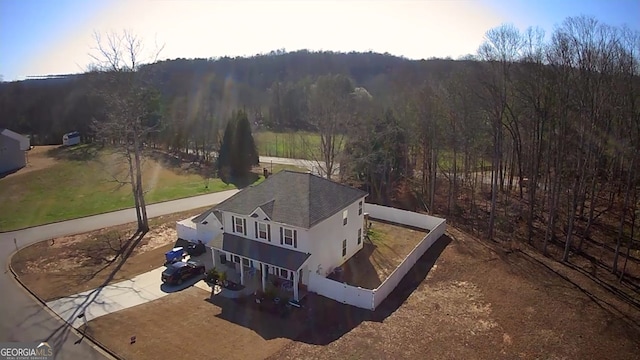 bird's eye view featuring a forest view