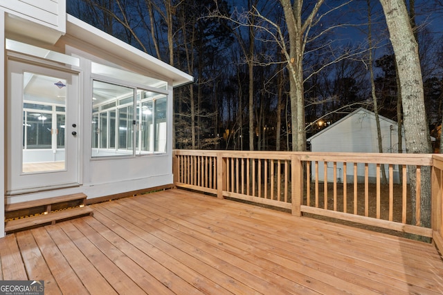 wooden deck with a sunroom