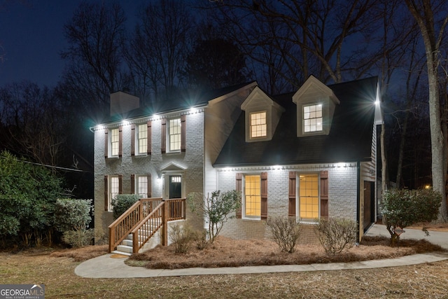 view of front of house featuring brick siding