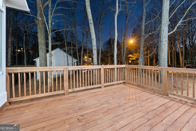 wooden deck with an outbuilding