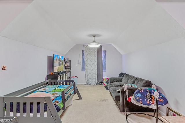 bedroom with vaulted ceiling and carpet