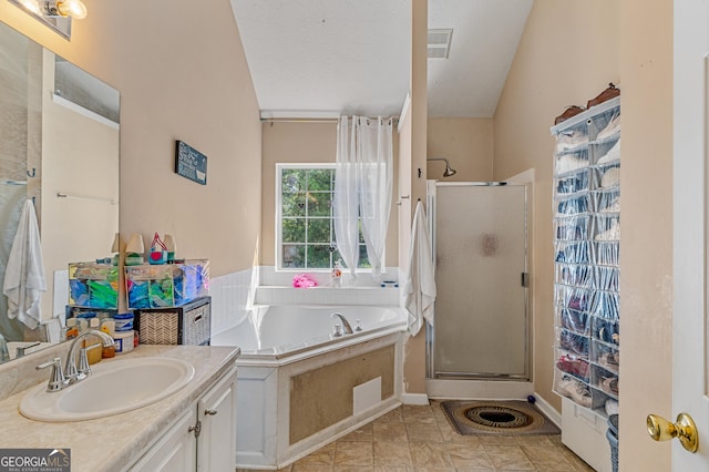 bathroom with visible vents, a textured ceiling, vanity, a shower stall, and a bath