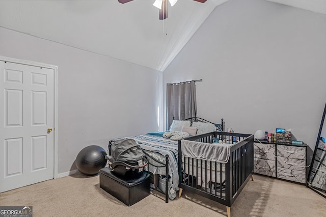 bedroom featuring a ceiling fan, carpet flooring, and high vaulted ceiling