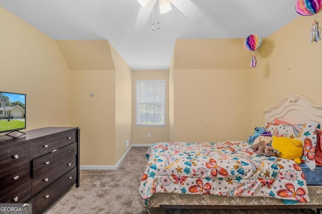 bedroom featuring a ceiling fan, light carpet, and baseboards