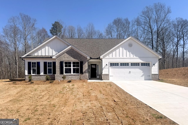 view of front facade featuring board and batten siding, concrete driveway, brick siding, and a garage