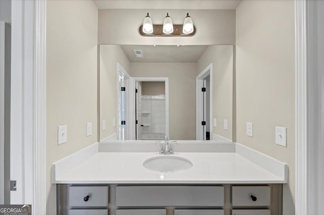 bathroom featuring vanity and visible vents