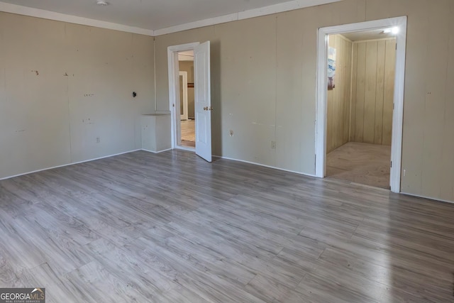 unfurnished room featuring wood finished floors