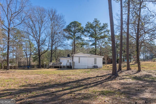 view of yard featuring a deck