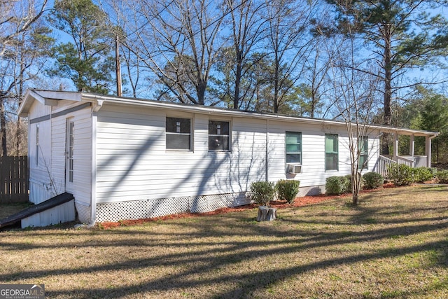 view of home's exterior with a lawn