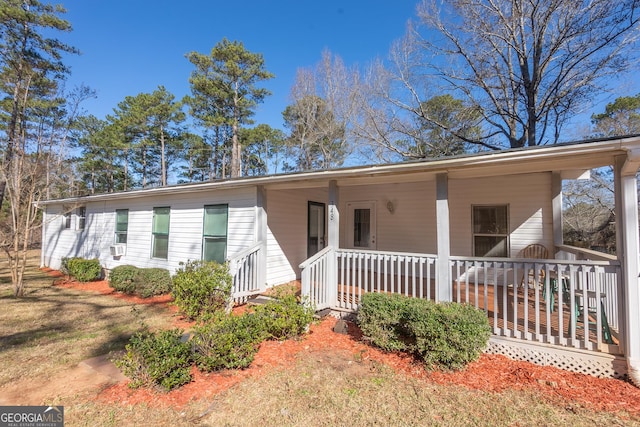 ranch-style house with covered porch