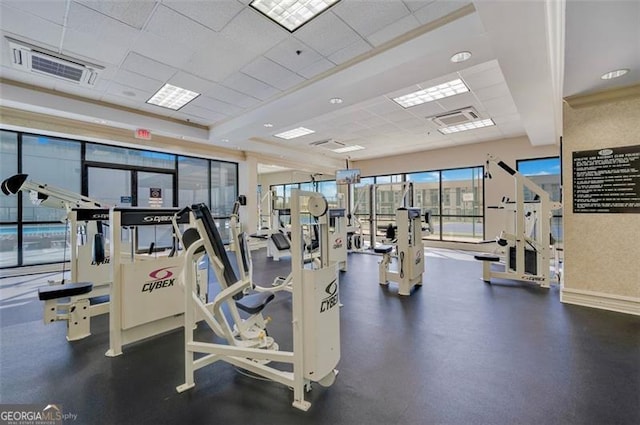 exercise room featuring visible vents and a drop ceiling