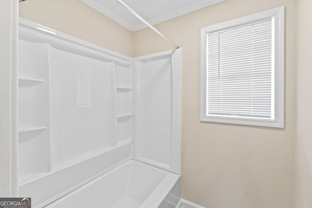 bathroom with shower / bathing tub combination and a wealth of natural light