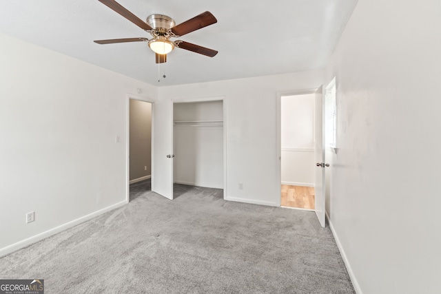 unfurnished bedroom with ceiling fan, a closet, baseboards, and carpet flooring