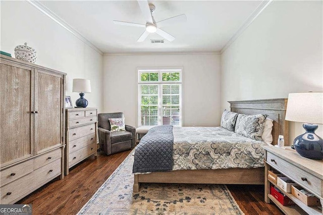 bedroom featuring dark wood-style floors, ceiling fan, visible vents, and crown molding